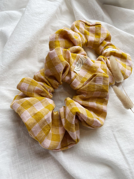checked pink and yellow linen scrunchie on white fabric